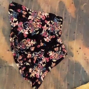 A skirt with flowers on it and holes.